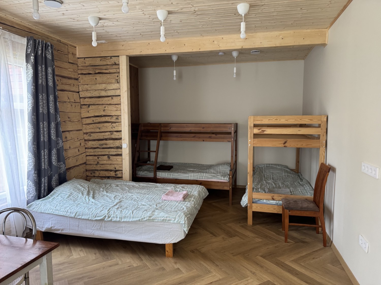 The sleeping room with beds and bunk beds